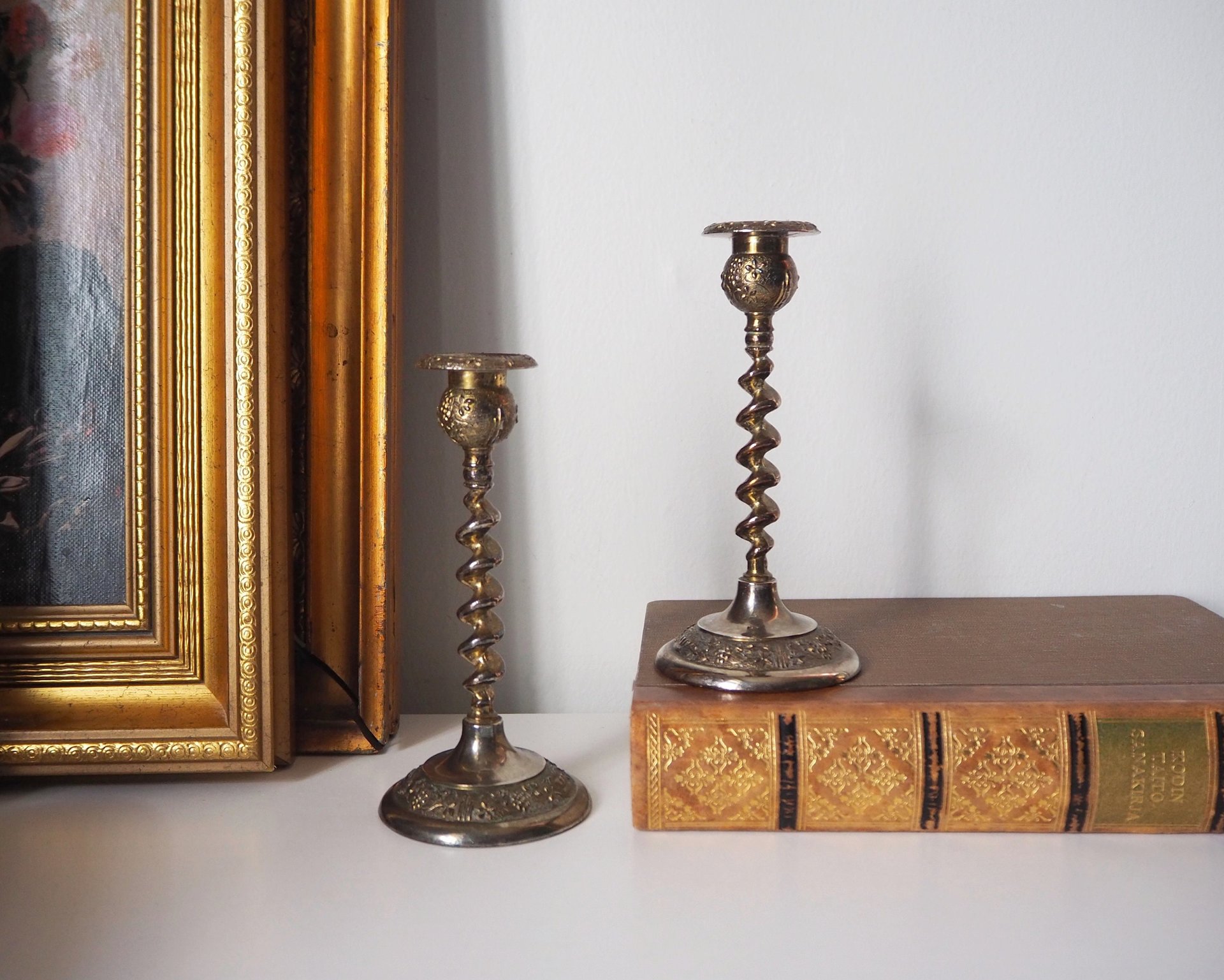 pair of small, twisted candlestick holders