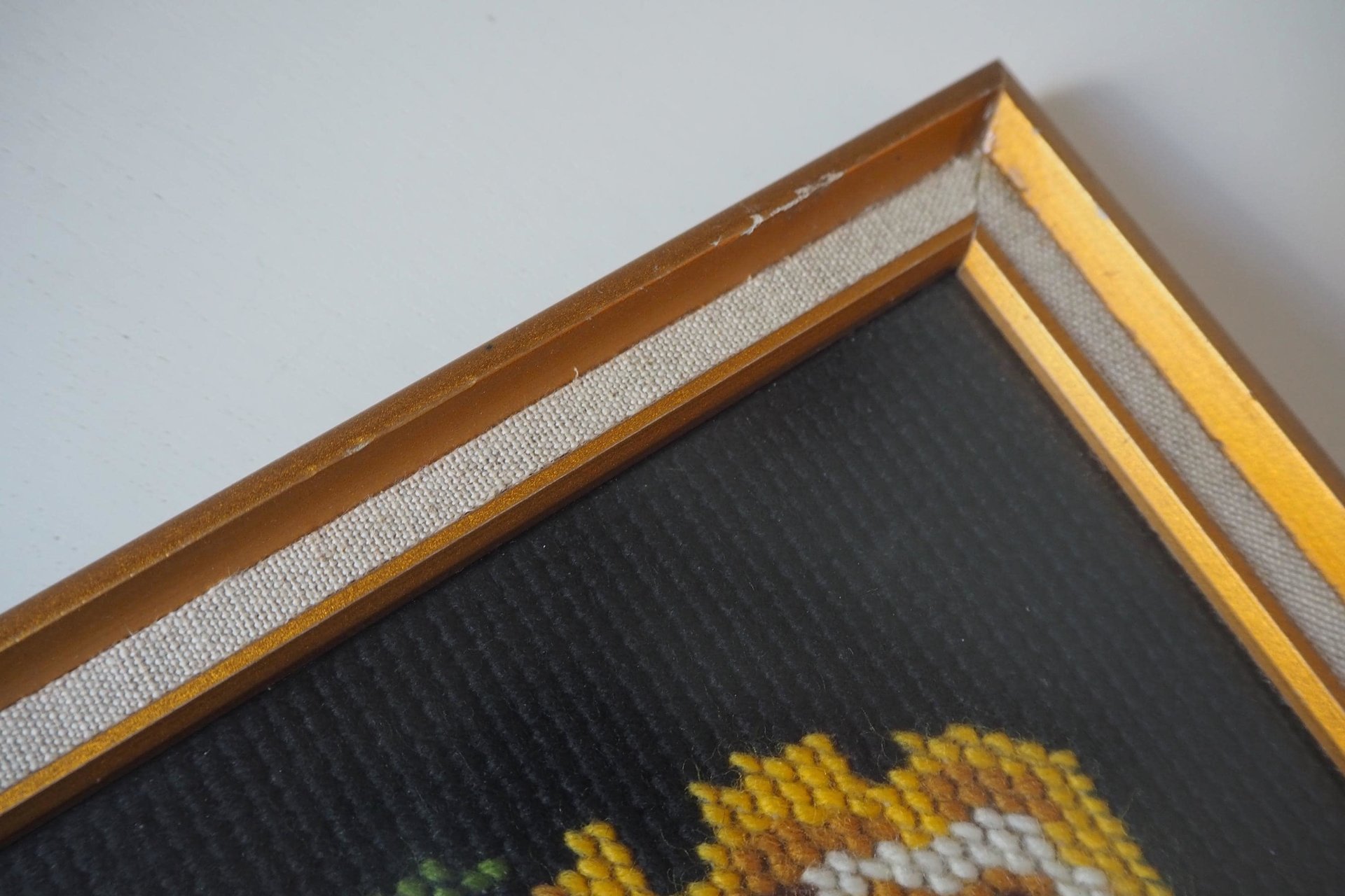 vintage needlepoint wall art with yellow roses