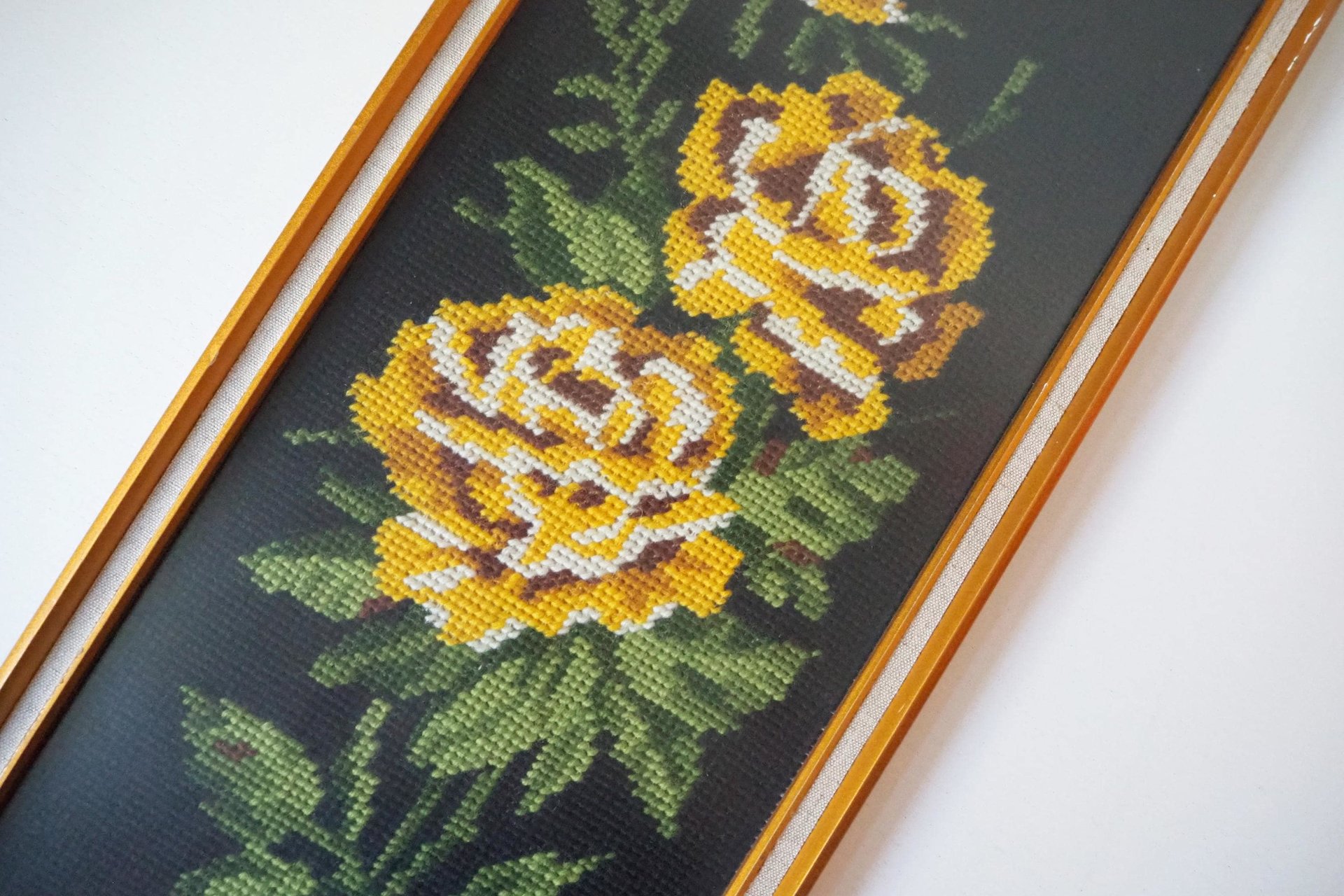 vintage needlepoint wall art with yellow roses