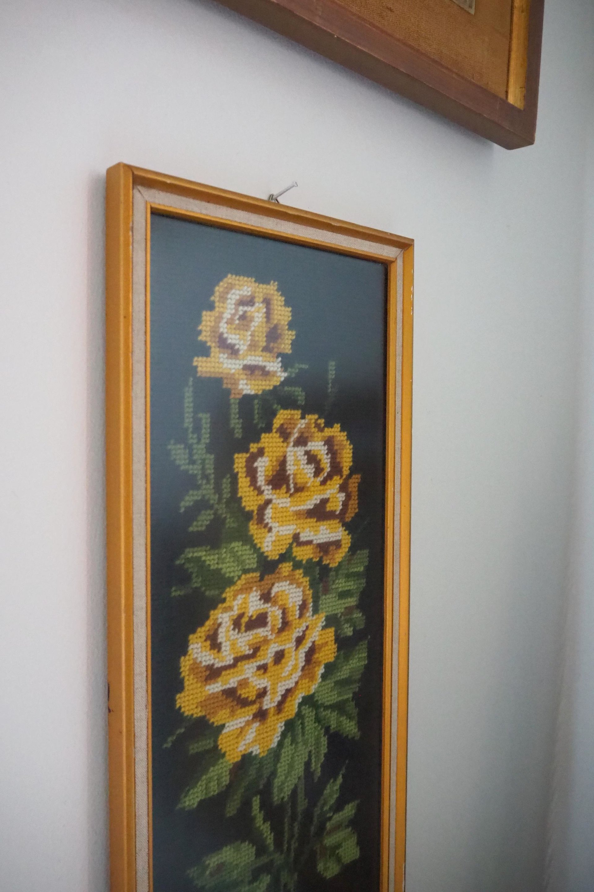 vintage needlepoint wall art with yellow roses