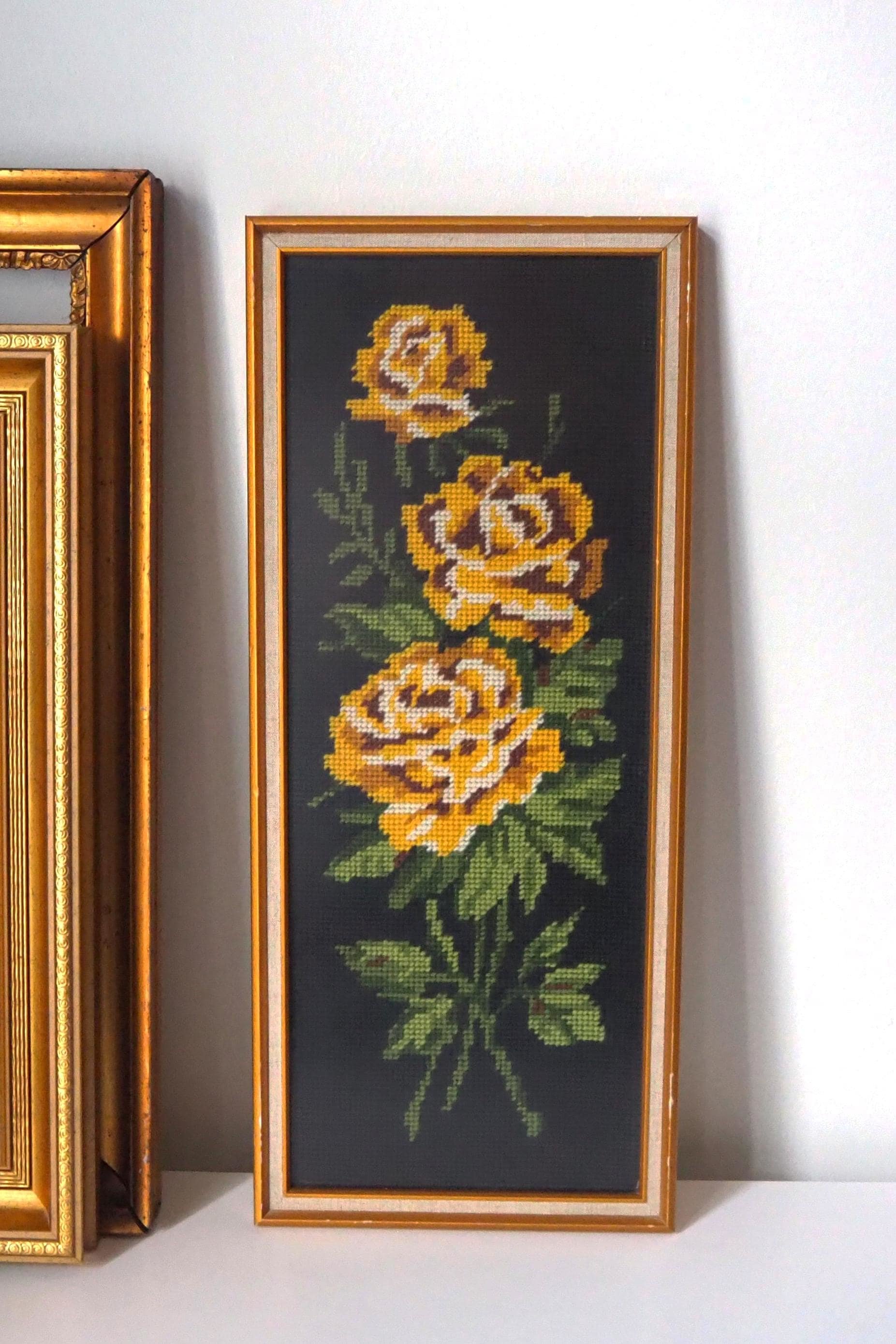 vintage needlepoint wall art with yellow roses