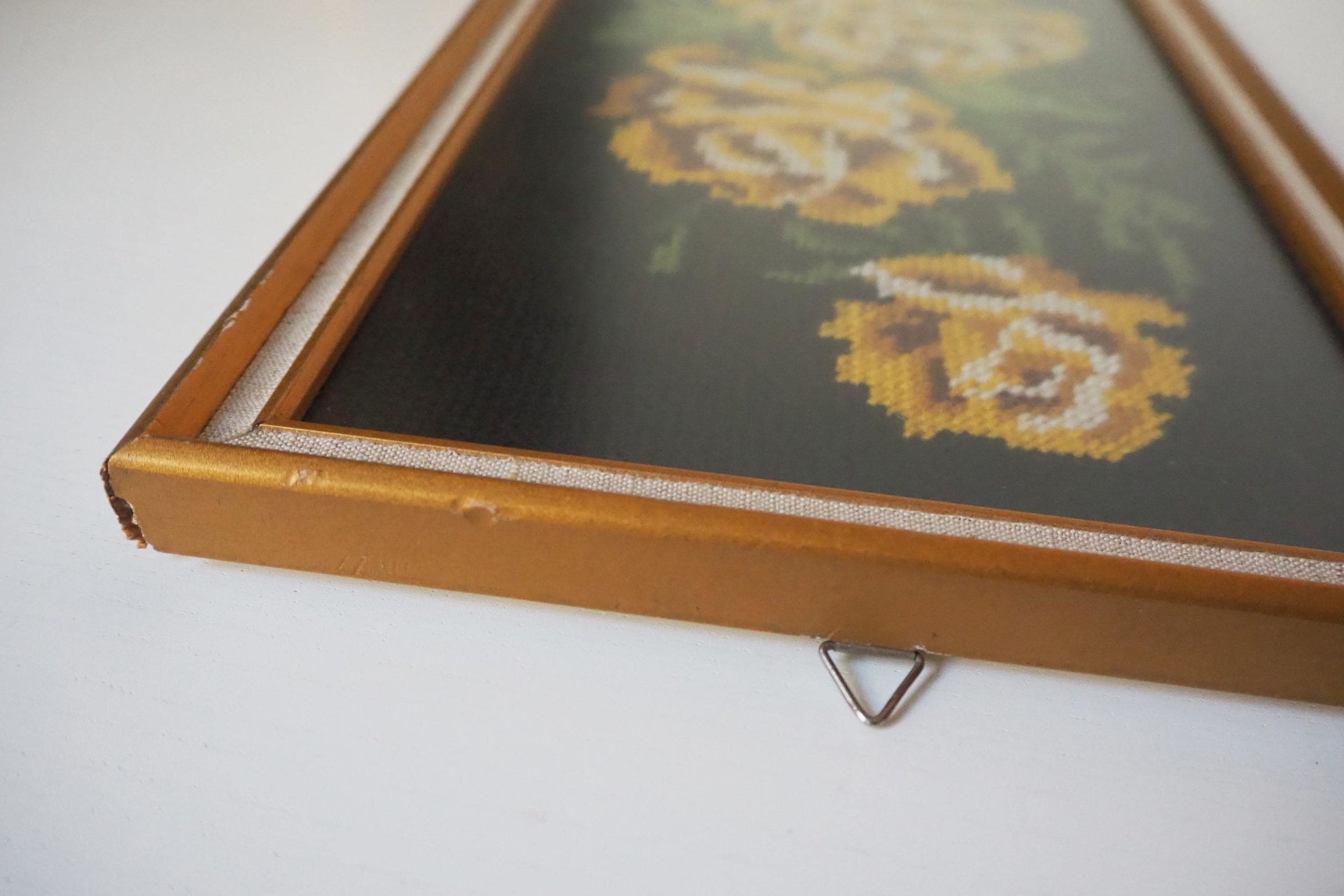 vintage needlepoint wall art with yellow roses