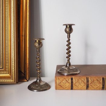 pair of small, twisted candlestick holders